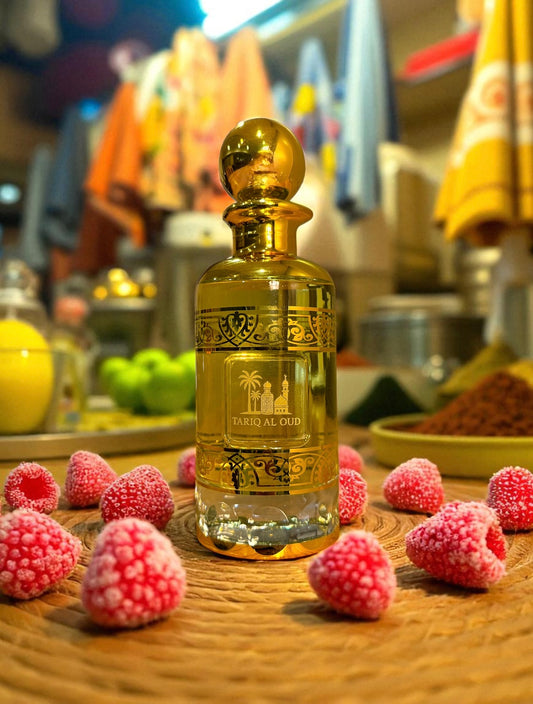 Gold perfume bottle and berries