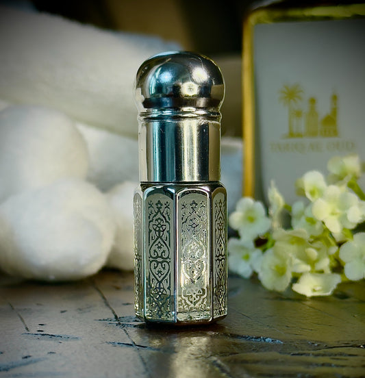 silver bottle with intricate design