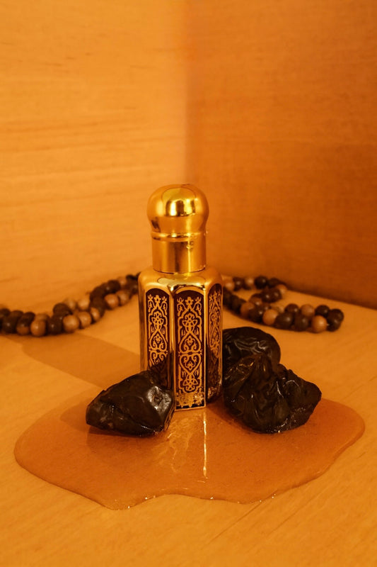 Perfume bottle with gold cap
